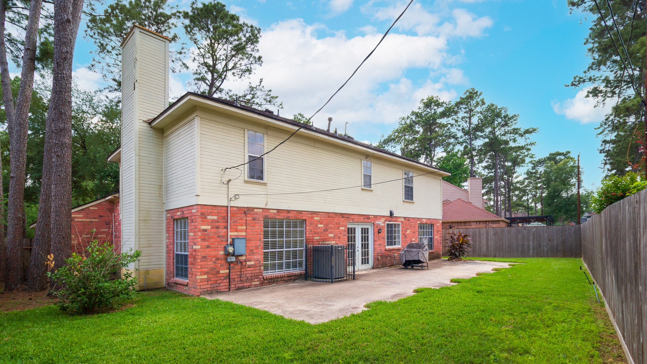 20214 Woodsboro Court Spring, TX 77388 - Photo 39 of 50 PRIVATE FENCED BACK YARD! HUGE Patio ready for Outdoor Living! LENNOX 17 SEER AC in 2018! TANKLESS WATER HEATER in 2025!