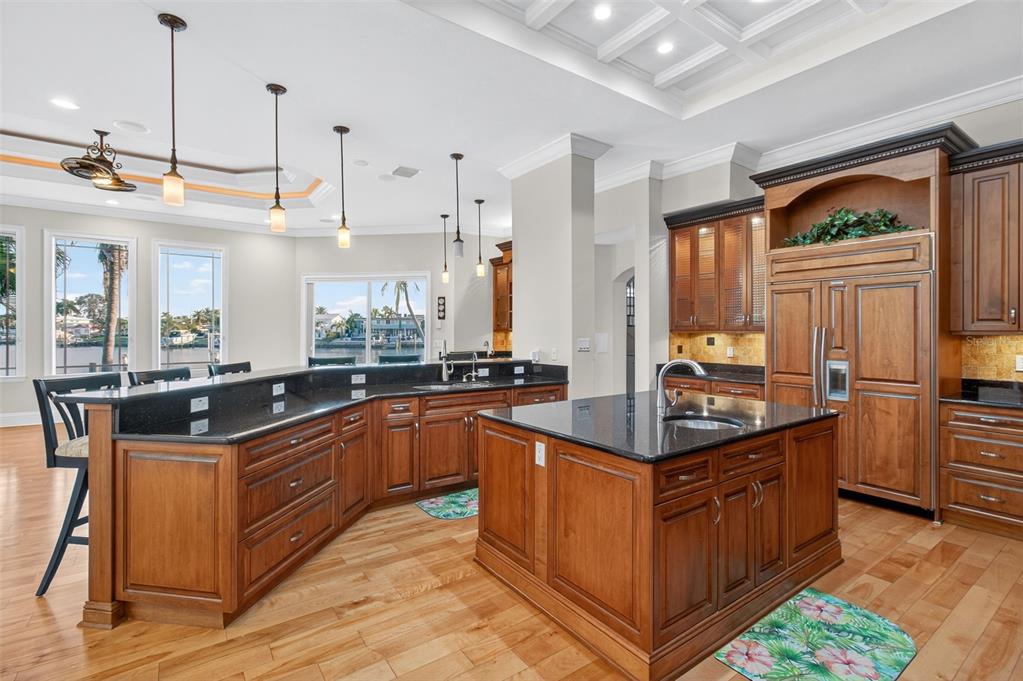 7986 9th Avenue South St. Petersburg, FL 33707 - Photo 11 of 83 a kitchen with stainless steel appliances granite countertop a stove a sink and a refrigerator