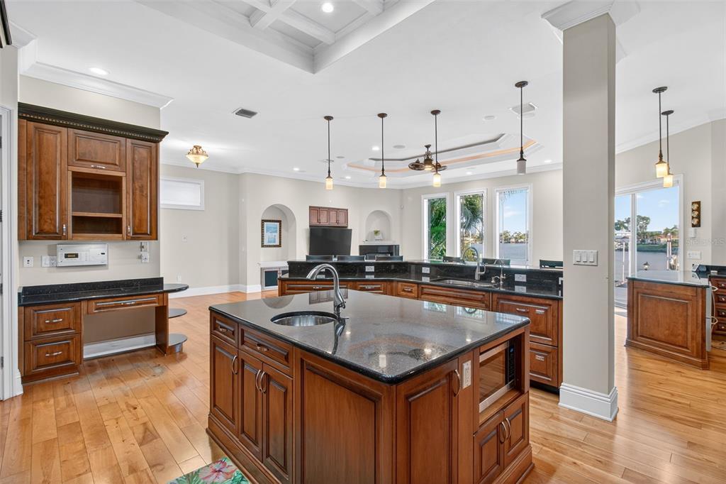 7986 9th Avenue South St. Petersburg, FL 33707 - Photo 14 of 83 a kitchen with granite countertop a sink counter top space and stainless steel appliances