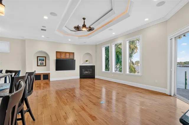 a bedroom with a bed window and television