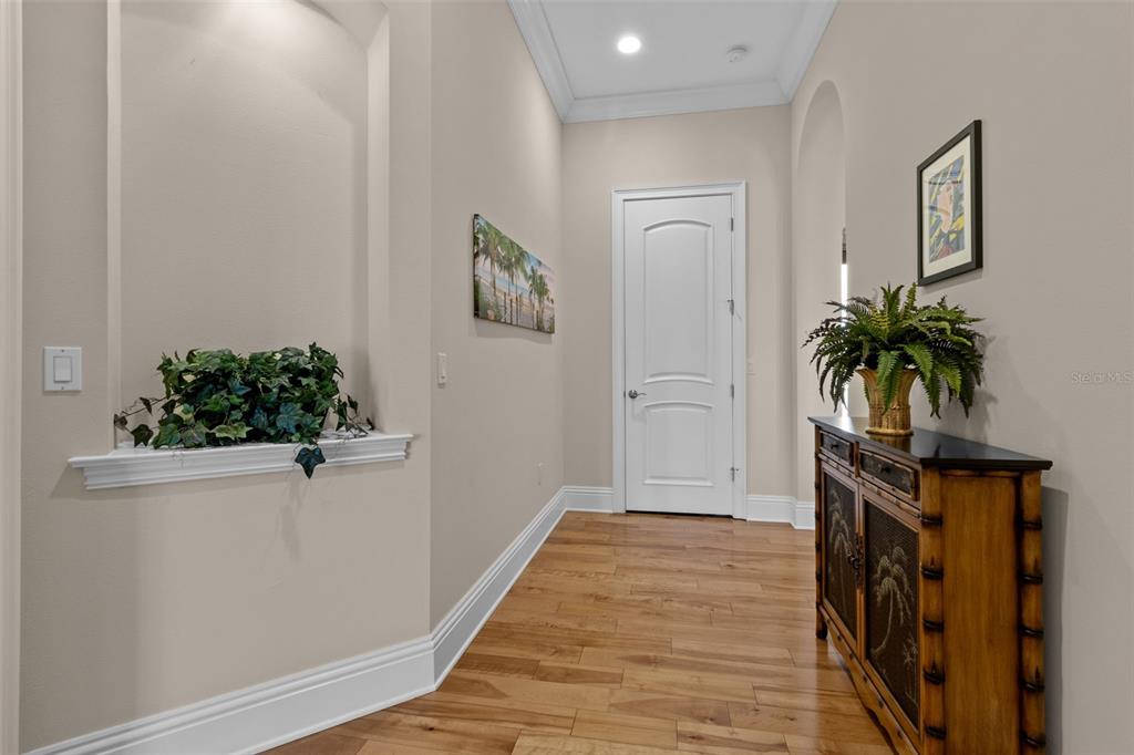 7986 9th Avenue South St. Petersburg, FL 33707 - Photo 19 of 83 a view of a hallway with wooden floor and a potted plant