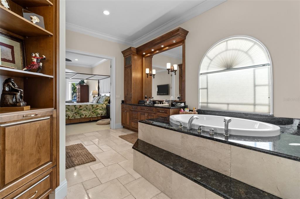 7986 9th Avenue South St. Petersburg, FL 33707 - Photo 26 of 83 a bathroom with a granite countertop sink mirror and