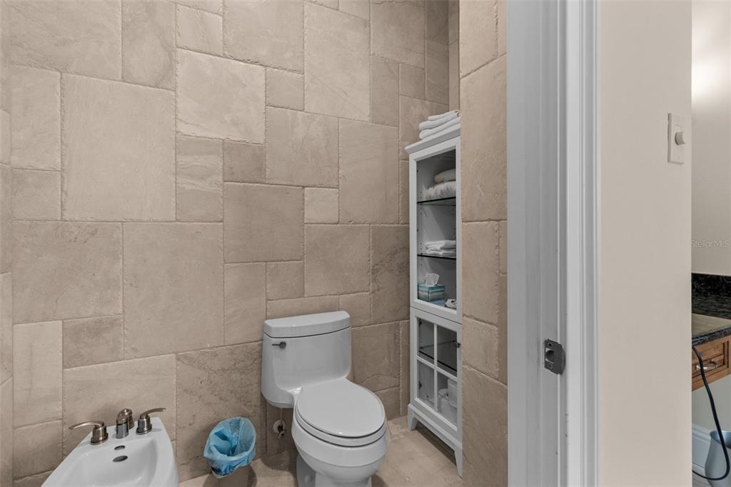 7986 9th Avenue South St. Petersburg, FL 33707 - Photo 29 of 83 a white toilet sitting next to a bathroom sink