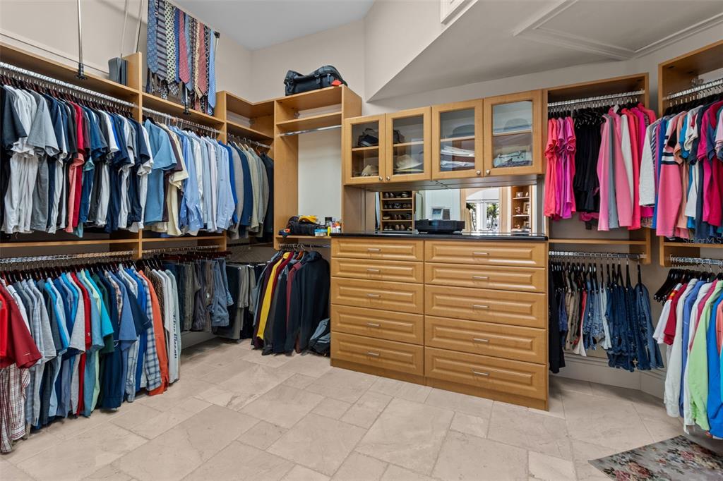 7986 9th Avenue South St. Petersburg, FL 33707 - Photo 30 of 83 a view of walk in closet with clothes and shoes