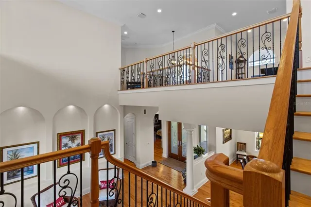 a view of a livingroom with furniture hardwood floor and a ceiling fan