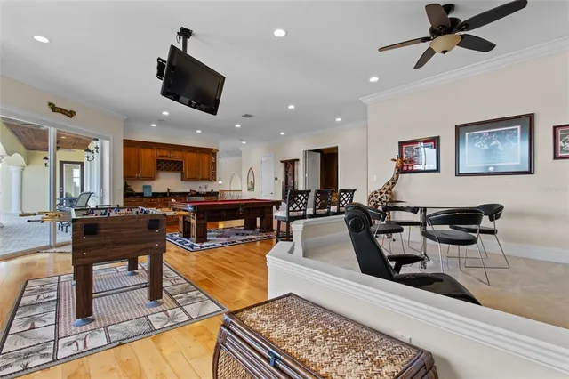 a bedroom with a bed and a flat tv screen on dresser