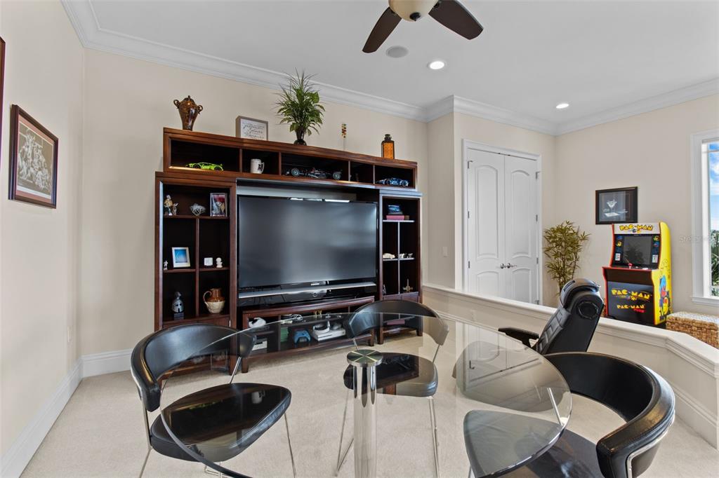 7986 9th Avenue South St. Petersburg, FL 33707 - Photo 38 of 83 a room with furniture and a flat screen tv