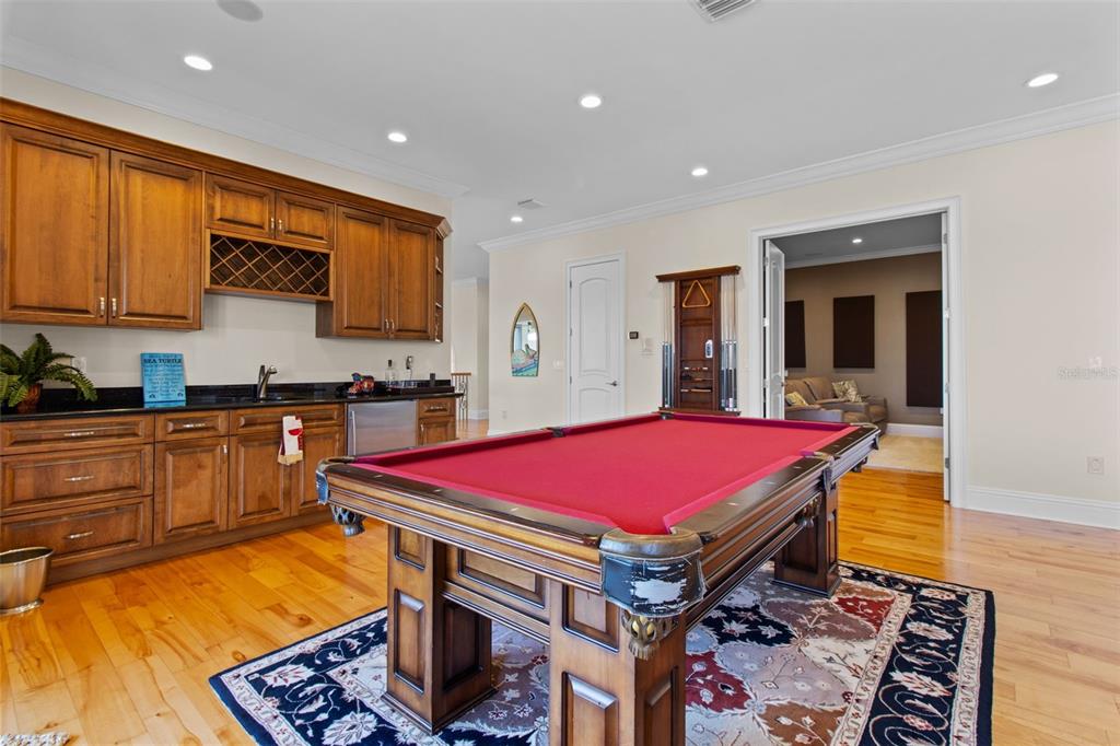 7986 9th Avenue South St. Petersburg, FL 33707 - Photo 39 of 83 a kitchen with stainless steel appliances kitchen island granite countertop sink stove and cabinets