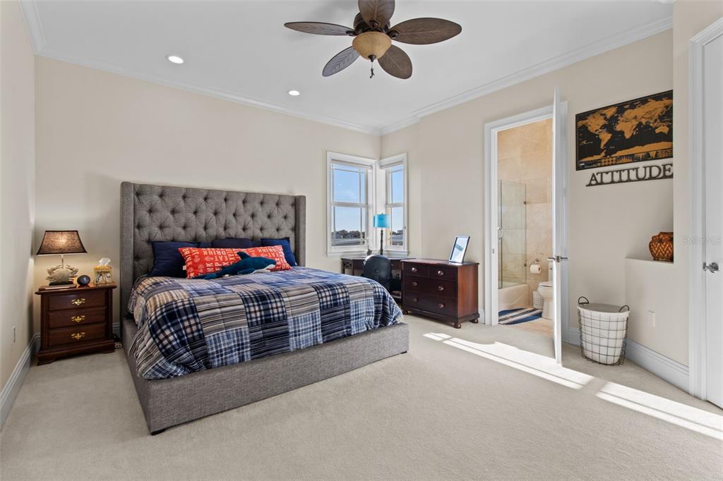 7986 9th Avenue South St. Petersburg, FL 33707 - Photo 53 of 83 a bedroom with a large bed and a chandelier