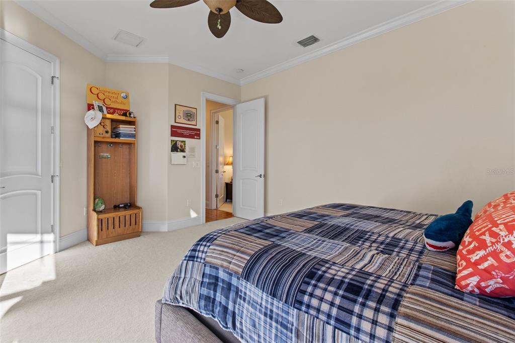 7986 9th Avenue South St. Petersburg, FL 33707 - Photo 54 of 83 a bedroom with a bed and wooden floor