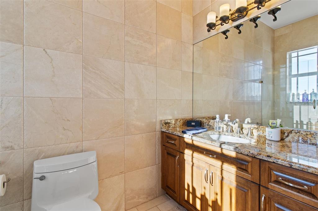 7986 9th Avenue South St. Petersburg, FL 33707 - Photo 55 of 83 a bathroom with a sink a toilet and shower