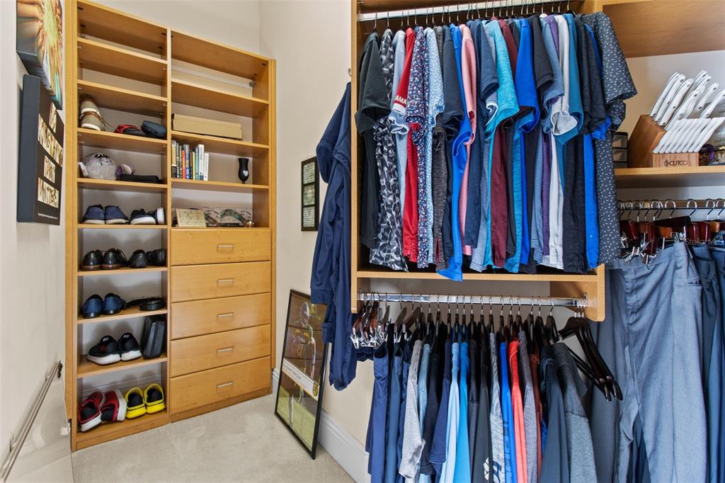 7986 9th Avenue South St. Petersburg, FL 33707 - Photo 56 of 83 a view of walk in closet with clothes and shoes