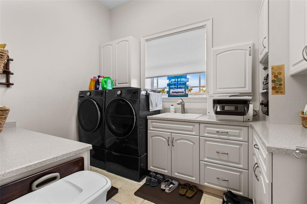 7986 9th Avenue South St. Petersburg, FL 33707 - Photo 60 of 83 a bathroom with a sink a toilet and a mirror