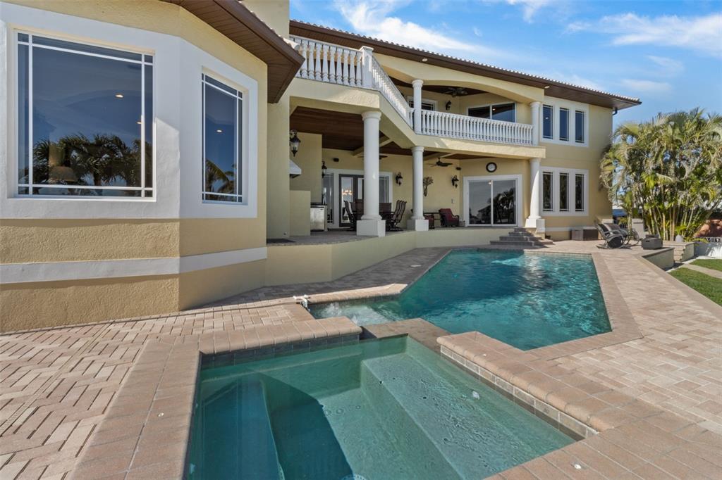 7986 9th Avenue South St. Petersburg, FL 33707 - Photo 67 of 83 a front view of a house with a yard porch and outdoor seating