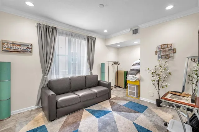 a kitchen with a sink and chairs