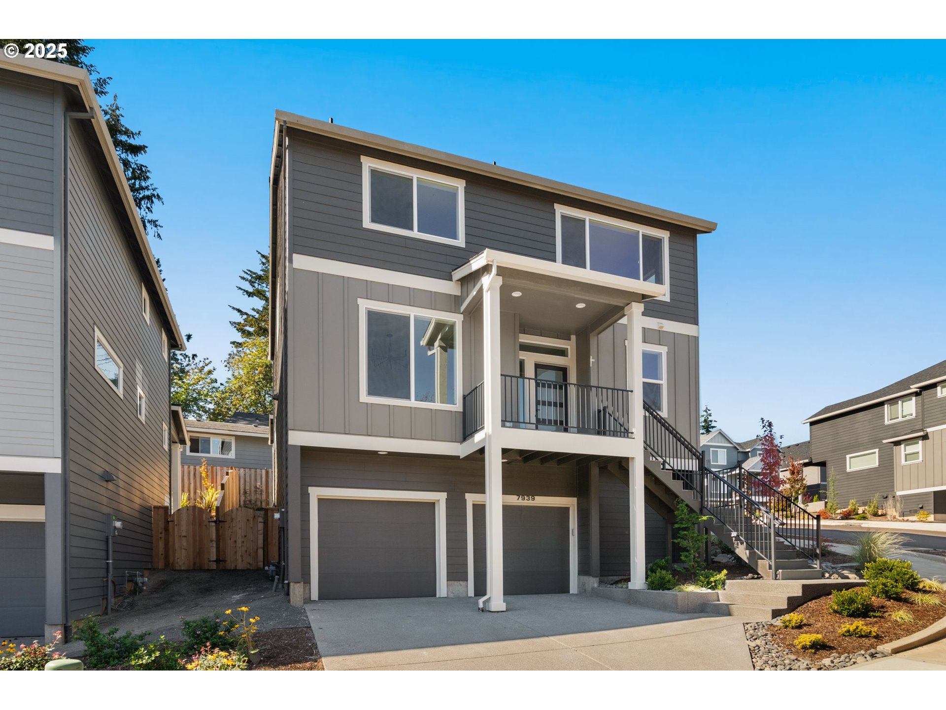 7939 Southwest 176th Terrace, Unit LOT1 Beaverton, OR 97007 - Photo 1 of 25 a front view of a house with a yard