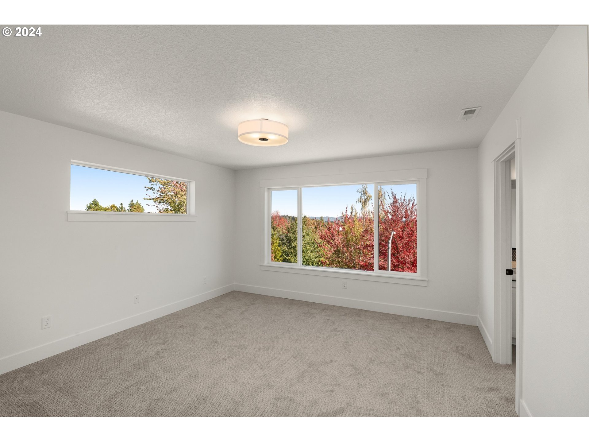 7939 Southwest 176th Terrace, Unit LOT1 Beaverton, OR 97007 - Photo 12 of 25 a view of an empty room with a window