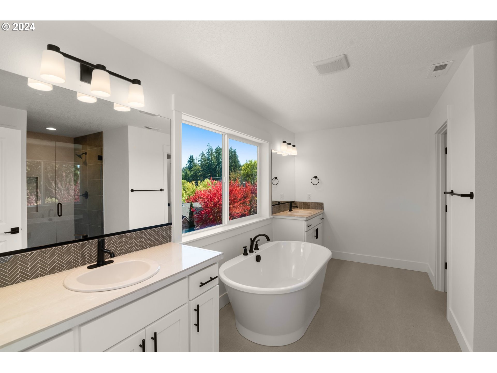 7939 Southwest 176th Terrace, Unit LOT1 Beaverton, OR 97007 - Photo 13 of 25 a bathroom with a sink and a mirror