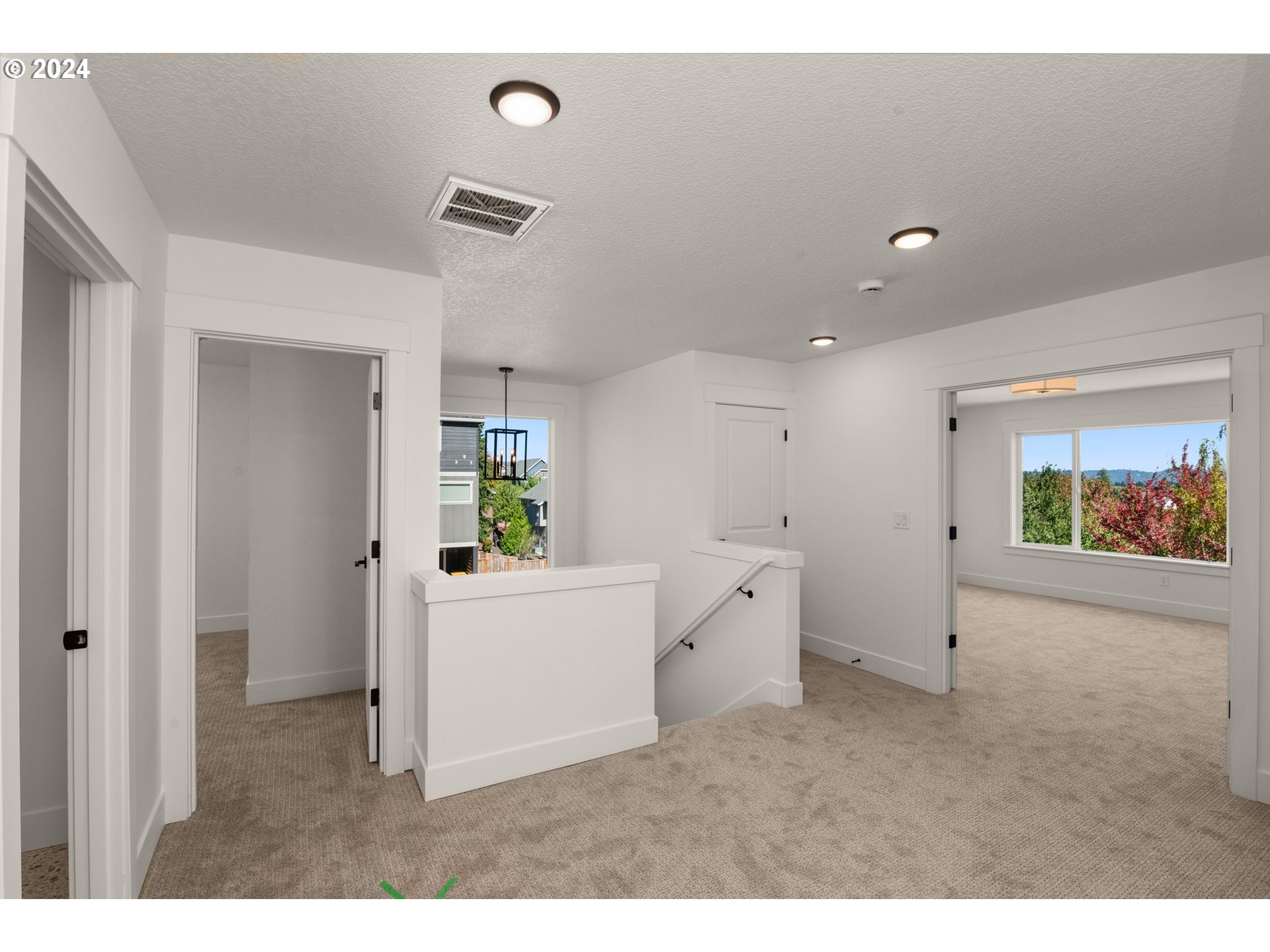 7939 Southwest 176th Terrace, Unit LOT1 Beaverton, OR 97007 - Photo 16 of 25 a view of a big room with windows and cabinet