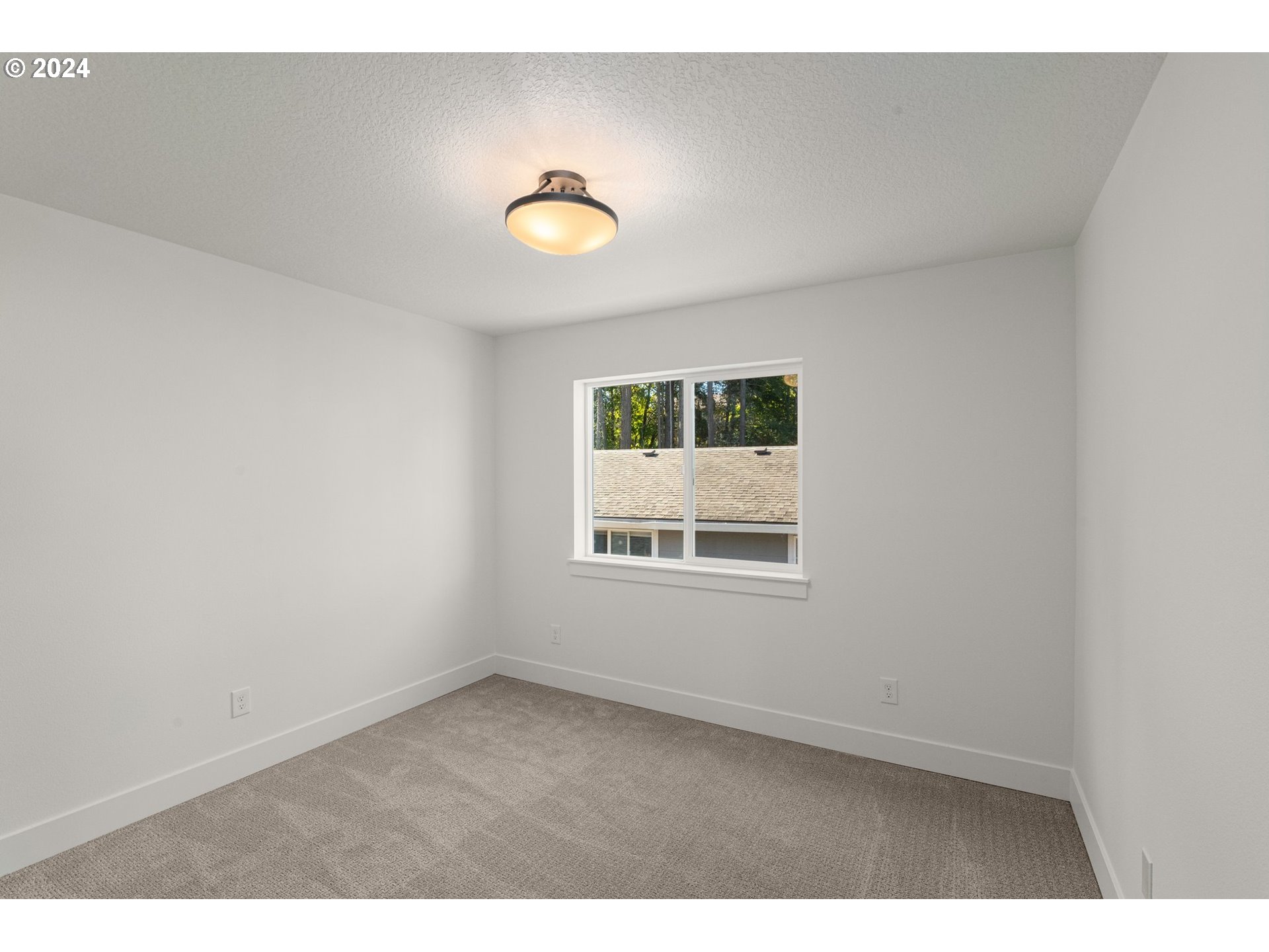 7939 Southwest 176th Terrace, Unit LOT1 Beaverton, OR 97007 - Photo 18 of 25 a view of an empty room with a window