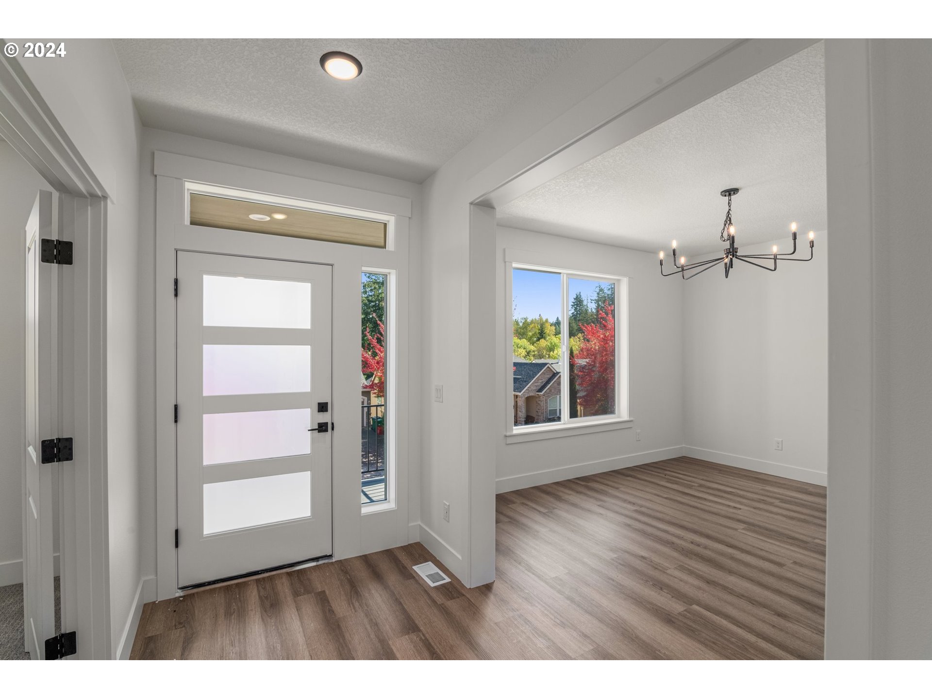 7939 Southwest 176th Terrace, Unit LOT1 Beaverton, OR 97007 - Photo 2 of 25 wooden floor in an empty room with a window