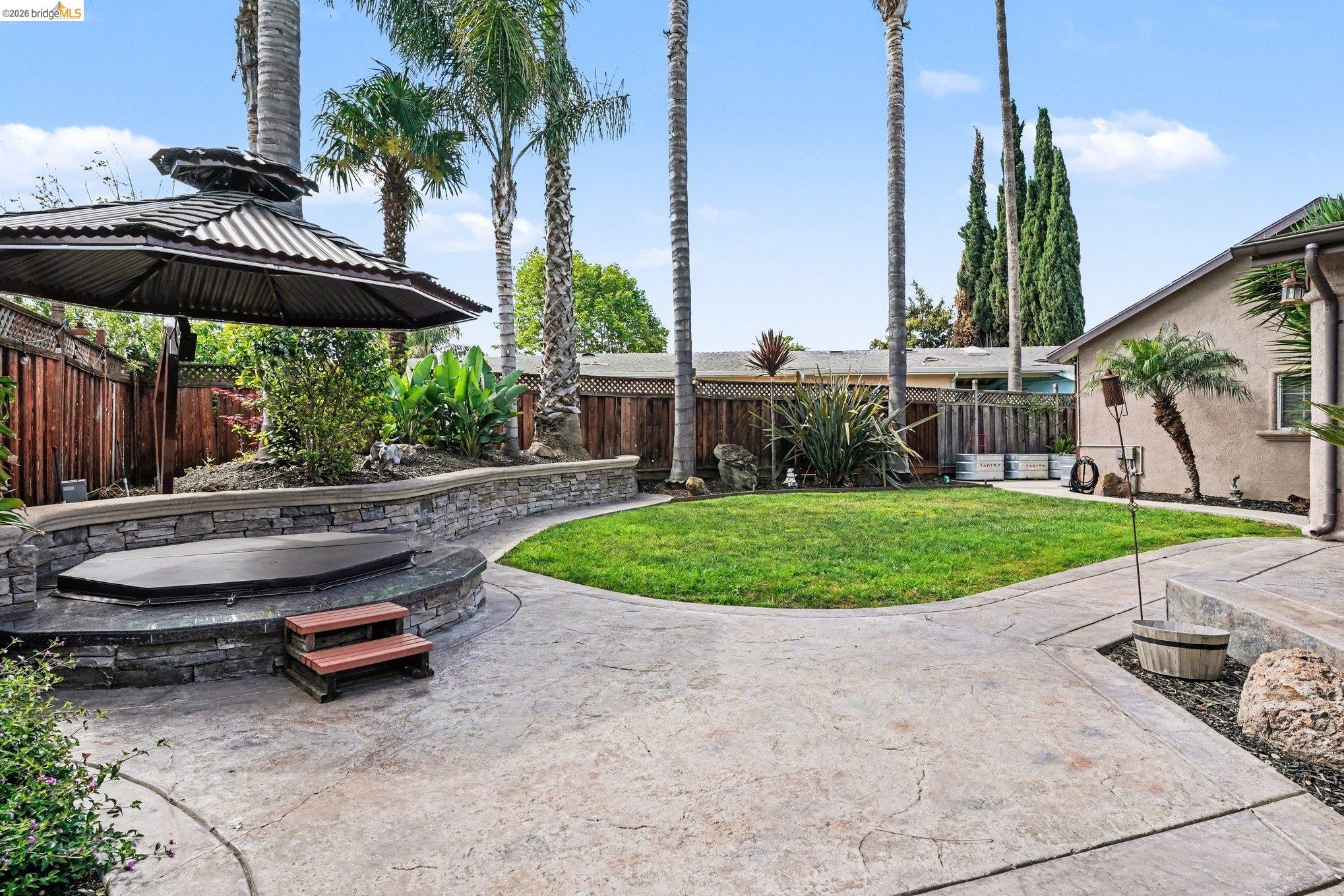 a view of a backyard with a patio