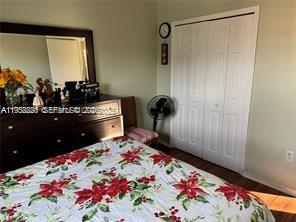 1250 Southeast 28th Court, Unit 206 Homestead, FL 33035 - Photo 16 of 26 a bedroom with a bed and a dresser