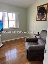 1250 Southeast 28th Court, Unit 206 Homestead, FL 33035 - Photo 18 of 26 a living room with furniture and a window
