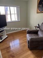 1250 Southeast 28th Court, Unit 206 Homestead, FL 33035 - Photo 20 of 26 a living room with furniture and a flat screen tv