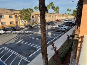 1250 Southeast 28th Court, Unit 206 Homestead, FL 33035 - Photo 23 of 26 a view of car parked on the street
