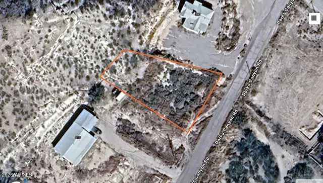 view of a dry yard with wooden fence