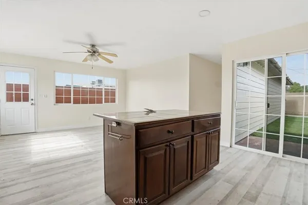 a kitchen with stainless steel appliances granite countertop a stove and cabinets