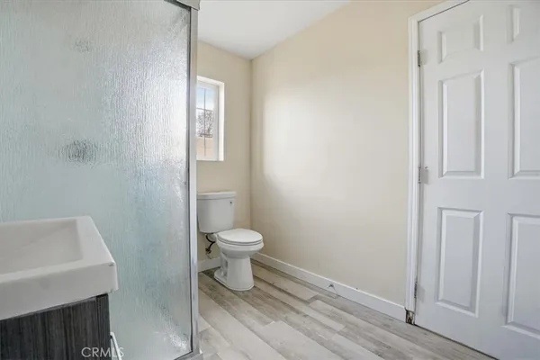 a white toilet sitting next to a bathroom sink