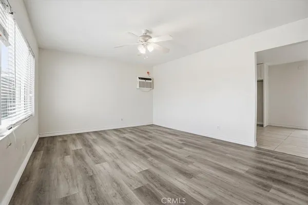 a view of a kitchen with an empty space and a window