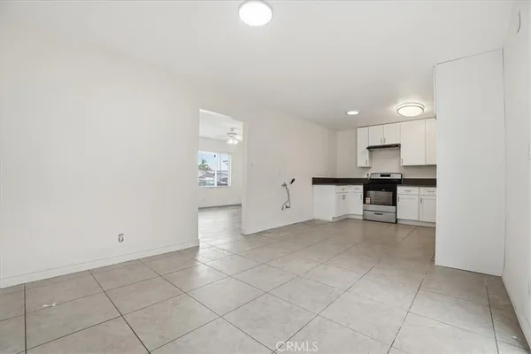 a view of kitchen with refrigerator cabinets and outdoor space
