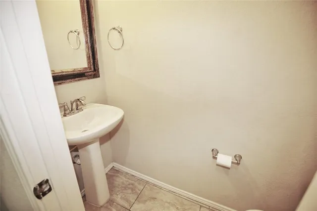 a bathroom with a sink and mirror
