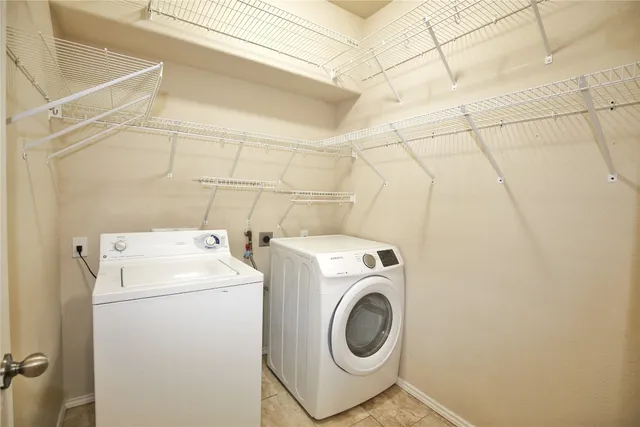 a utility room with dryer and washer