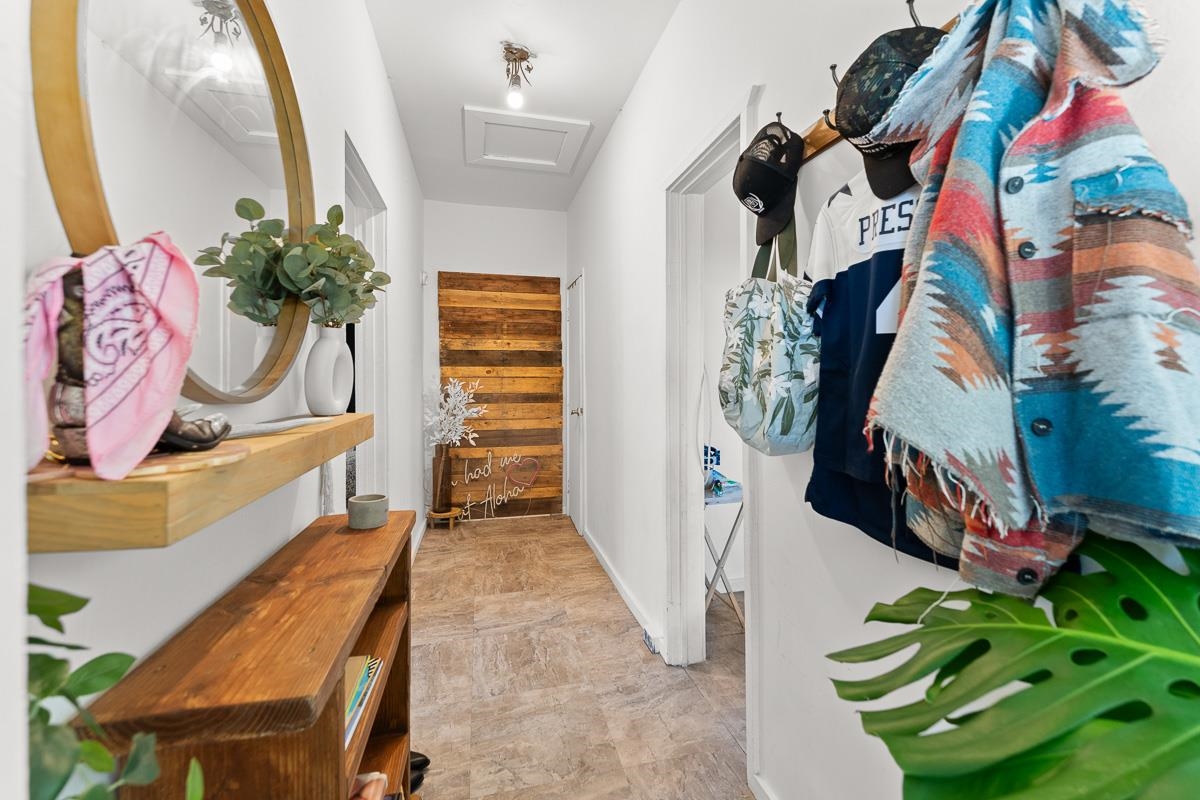 2970 Kailiili Road, Unit 1B Haiku, HI 96708 - Photo 30 of 47 a view of walk in closet with clothes and shoes