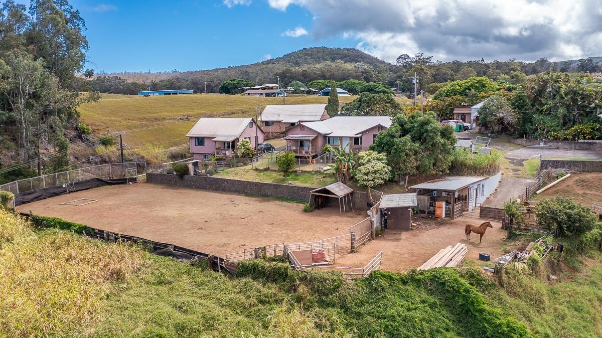 2970 Kailiili Road, Unit 1B Haiku, HI 96708 - Photo 45 of 47 an aerial view of a house with yard and lake view