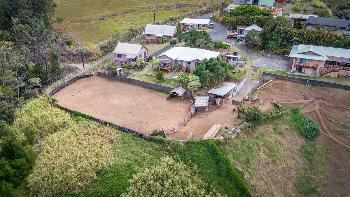 2970 Kailiili Road, Unit 1B Haiku, HI 96708 - Photo 46 of 47 an aerial view of a house with a garden and lake view