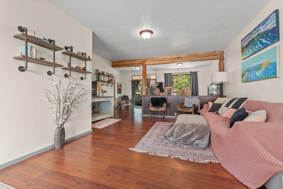 2970 Kailiili Road, Unit 1B Haiku, HI 96708 - Photo 5 of 47 a living room with furniture and a wooden floor
