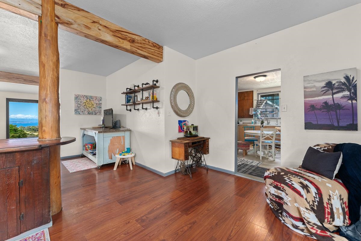 2970 Kailiili Road, Unit 1B Haiku, HI 96708 - Photo 6 of 47 a living room with furniture and a wooden floor