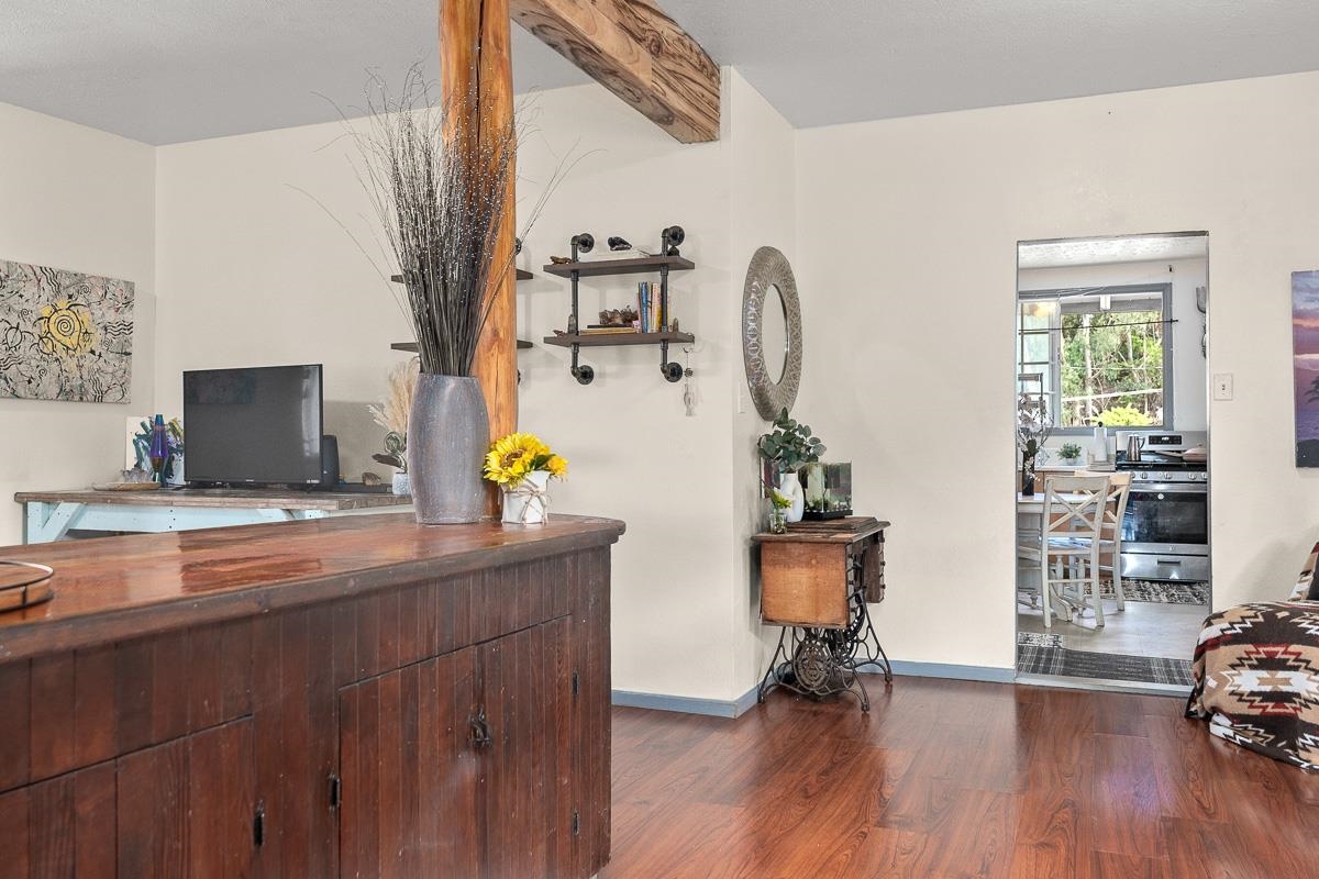2970 Kailiili Road, Unit 1B Haiku, HI 96708 - Photo 7 of 47 a room with furniture and wooden floor