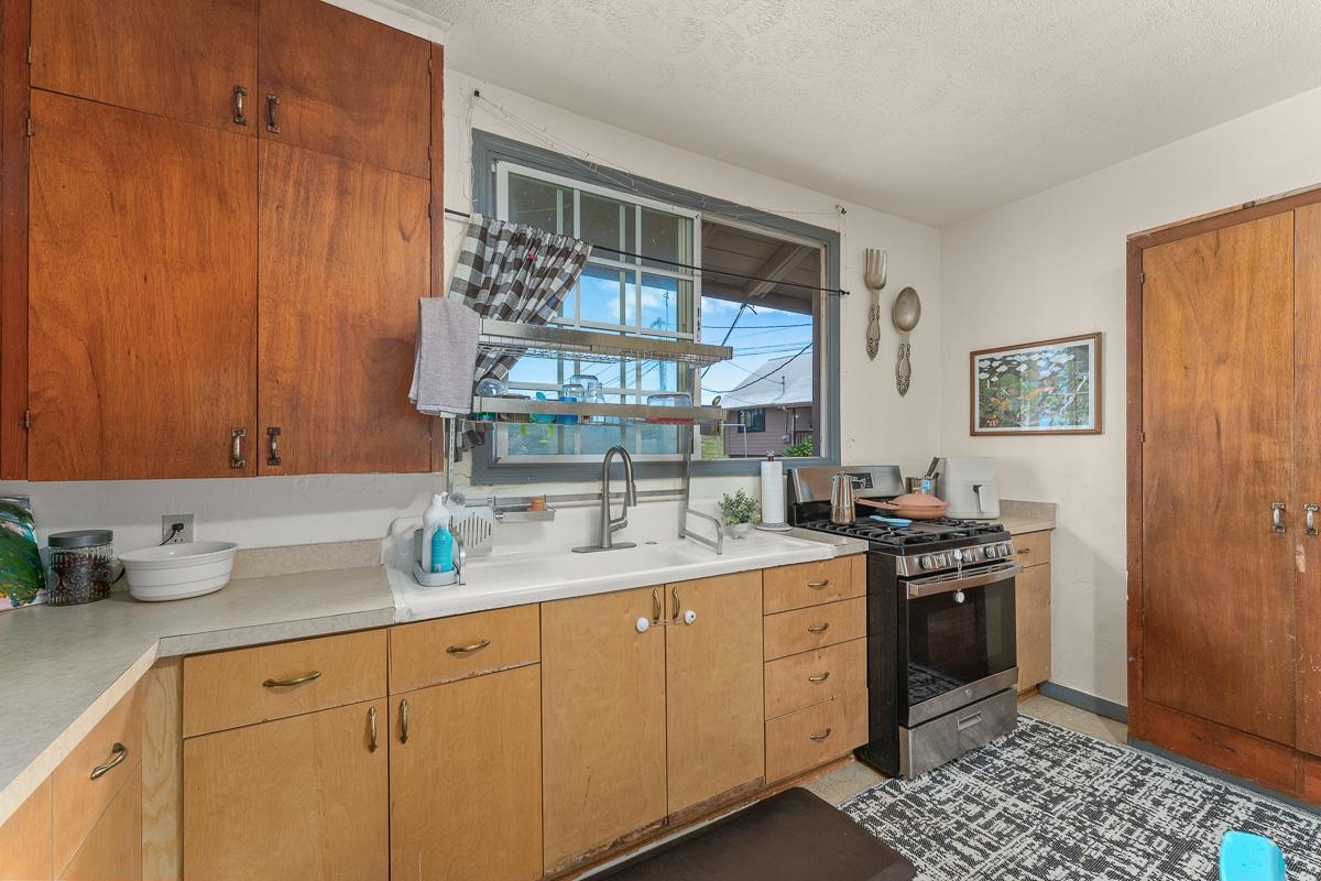 2970 Kailiili Road, Unit 1B Haiku, HI 96708 - Photo 9 of 47 a kitchen with a sink and cabinets