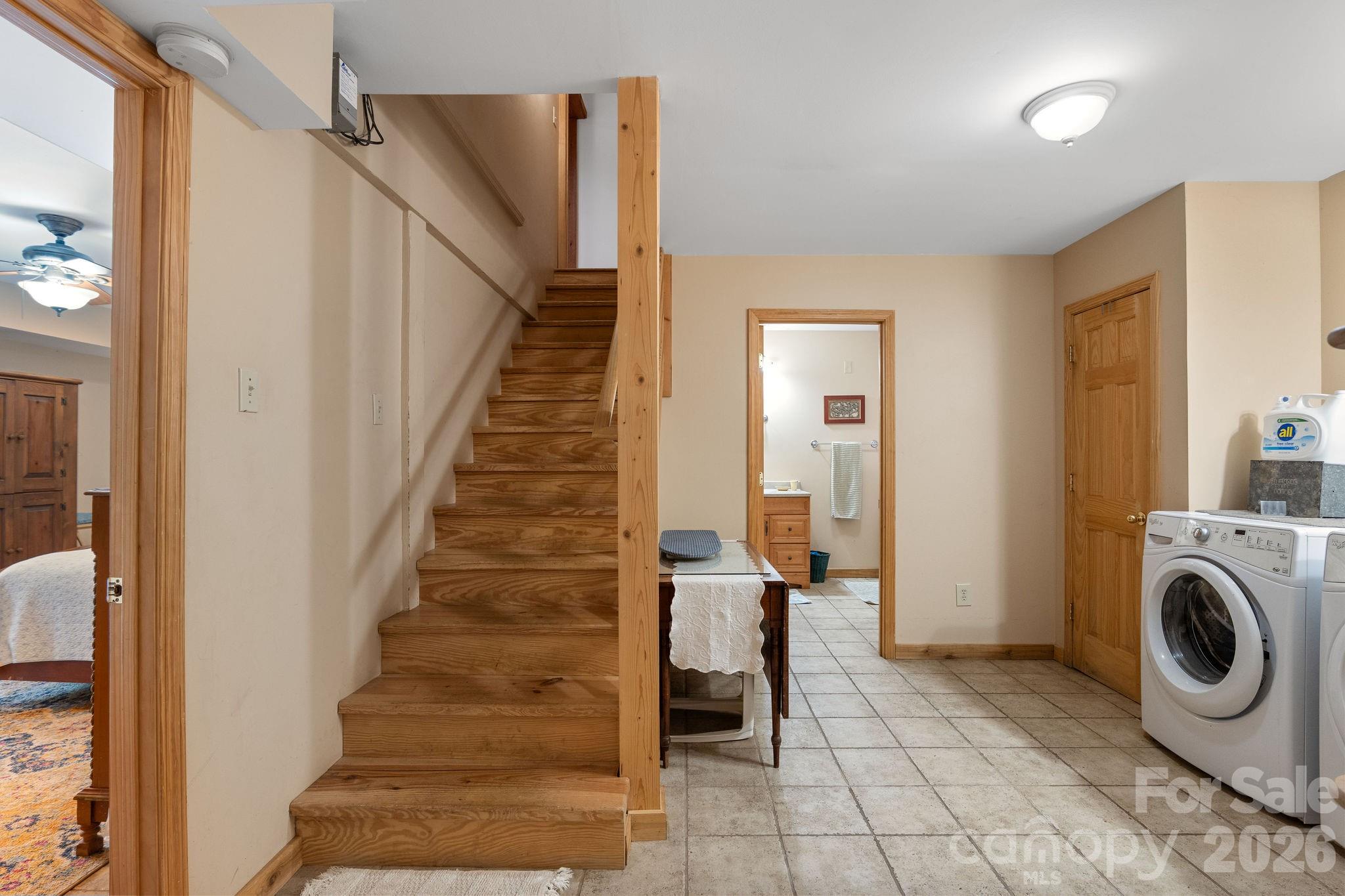 150 Avondale Ridge Road Asheville, NC 28803 - Photo 36 of 45 a view of a hallway with washer and dryer