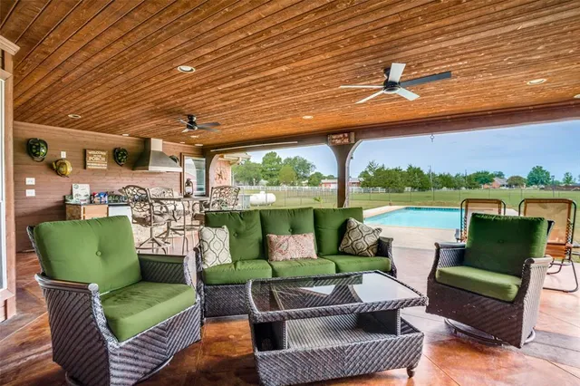 a outdoor living space with furniture and garden view