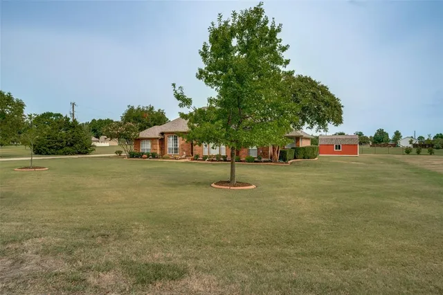 a view of outdoor space with deck and yard