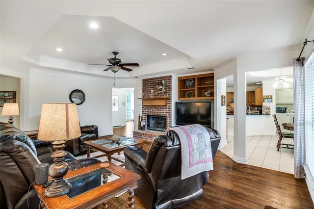 a view of a livingroom with furniture and a window