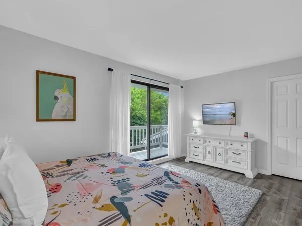 a bed room with a bed and a window