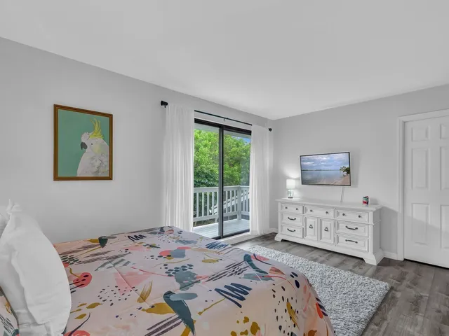 a bed room with a bed and a window